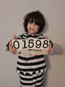 Child in prisoner Halloween costume